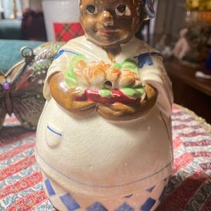Charming Ceramic Figurine with Blue and Brown Accents